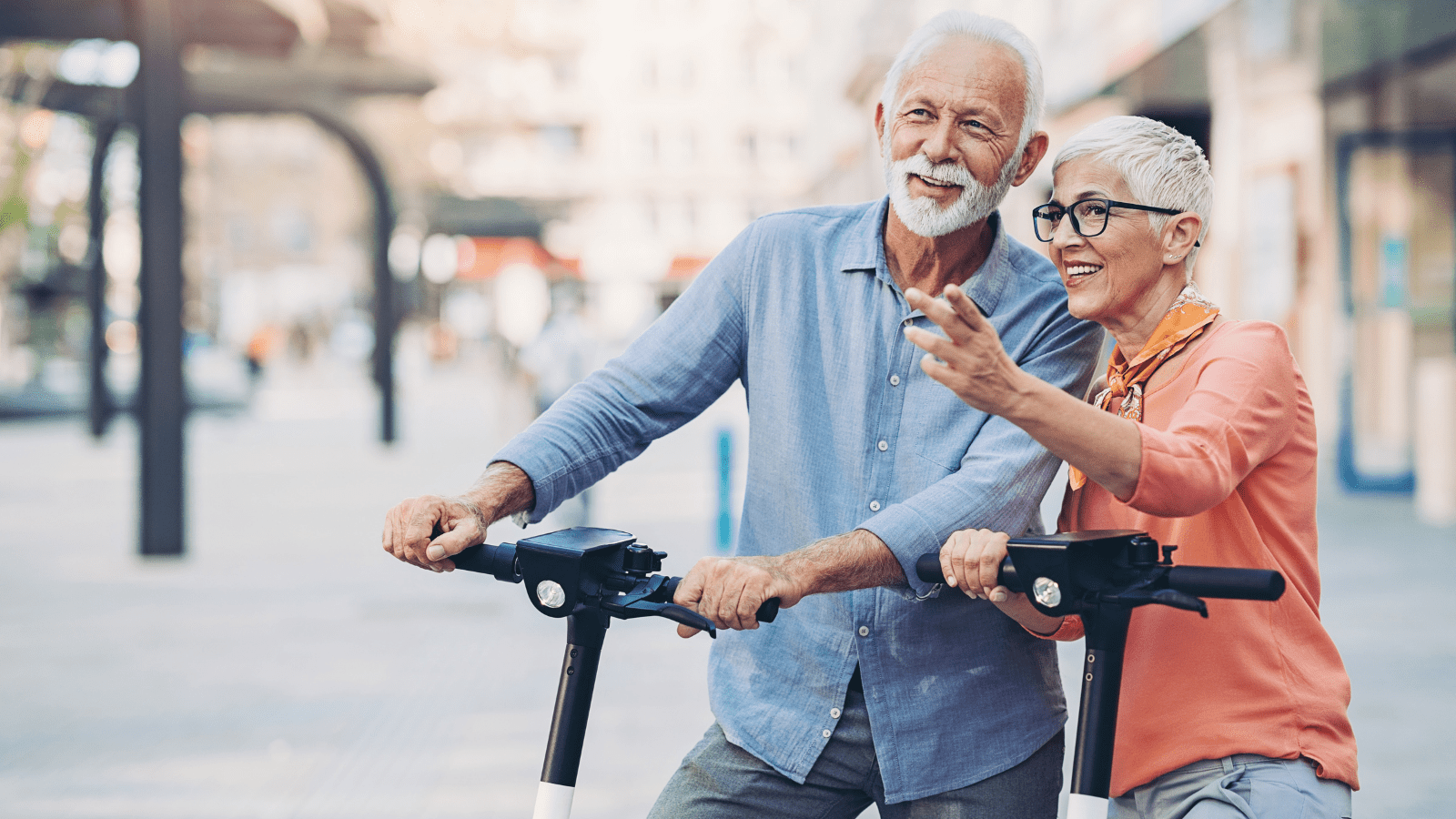 senior couple on scooters